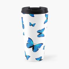 a white and blue travel mug with butterflies on the side, sitting against a white background