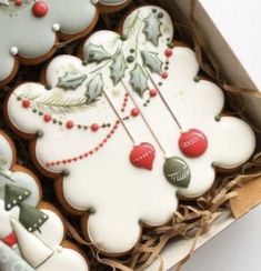 some decorated cookies in a box on a table