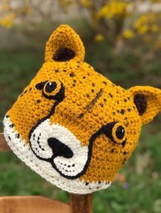 a crocheted hat with a tiger face on it