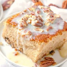 a close up of a plate of food with pecan toppings and icing