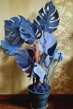 a potted plant sitting on top of a wooden table