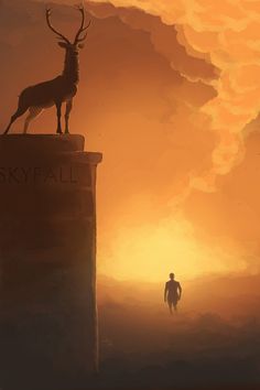 a man standing on top of a tall tower next to a deer statue