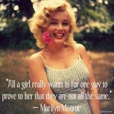 marilyn monroe with a flower in her hair and the quote, i'm a girl really wants is for one guy to prove that they are not all the same