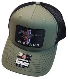 All the hats are shipped in a box for protection. Thank you. Show off your love for Mustangs with this stylish Richardson 112 Trucker Hat in Loden/Black. Made from breathable cotton twill fabric, this hat features a solid pattern with a mesh back and adjustable snapback closure to ensure a comfortable fit for all head sizes. Perfect for casual wear or workwear, this unisex hat is a must-have accessory for any Mustang fan. The hat is designed with the iconic Mustang logo and is suitable for all seasons, making it a versatile addition to your wardrobe. Made in Bangladesh, this hat is perfect for anyone who loves fashion and Mustangs. Mustang Logo, Twill Fabric, Embroidered Patch, Cotton Twill Fabric, Solid Pattern, Embroidered Patches, In A Box, All Seasons, Cotton Twill