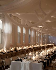 the tables are set with white and black linens