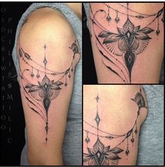 some tattoos that are on the arm and shoulder