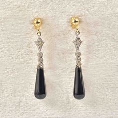 Visit our shop here to browse the entire collection - https://www.etsy.com/uk/shop/EllibelleJewellery Experience timeless elegance with these exquisite Art Deco style teardrop earrings! Crafted with attention to detail, each earring features a sleek and polished black onyx drop, complemented by four brilliant diamonds set in white gold. The 1920s-inspired design exudes sophistication and glamour, while the post and butterfly backs provide secure and comfortable wear. Whether you're dressing up f Evening Teardrop Earrings With Polished Finish, Teardrop Earrings With Polished Finish For Evenings, Elegant Pierced Teardrop Earrings, Elegant Pierced Teardrop Pendant, Elegant Long Drop Teardrop Earrings With Polished Finish, Formal Long Drop Pierced Teardrop Earrings, Pierced Teardrop Earrings For Evening, Elegant Polished Teardrop Earrings For Formal Events, Elegant Polished Teardrop Earrings For Formal Occasions