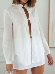 Beach Button-up Blouse With Button Cuffs, Spring Beach Top With Placket, Spring Tops With Placket, Daywear Top With Placket, Chic Summer Tops With Placket, Chic Daywear Shirt With Button Closure, Chic Blouse With Buttons For Daywear, Solid Tops With Button Closure For Day Out, Chic Summer Tops With Back Button Closure