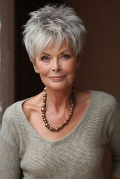 This fun hairstyle has a playful yet refined short style with layered sections that add fullness and motion, perfectly matching women over 70 who embrace a lively and youthful spirit. The lovely mix of smooth and pointy layers provides a contemporary spin on the typical pixie cut, framing the face with gentleness and panache. Its silvery-grey hue broadcasts maturity and - Click to see more of Discover 27 Time-Saving Tips for Women Embracing Life After 70 and follow us for more hairstyle ideas. Spiked Short Hair Women, Short Hair For Elderly Women Over 50, Short Hairstyles For Women Over 70 Gray, Short Pixie Cuts For Older Women, Pixie Haircut For 60+, Women’s Silver Hair, Hair Styles For Women Over 70, Short Hair Cuts For Fine Hairfor Women Over 60, Fine Hair Cuts