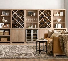 a living room filled with furniture and wine bottles