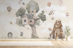 an animal themed wallpaper in a child's room with a tree and house