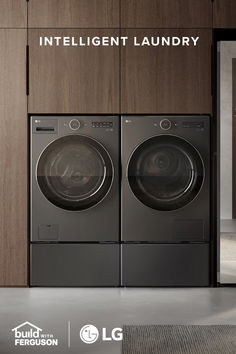 the front load washer and dryer are next to each other in this modern laundry room