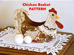 a chicken basket with eggs on a doily