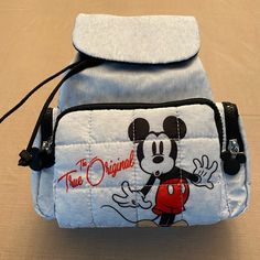 Brand New With Tags. Disney Mickey Mouse Primark Exclusive. Drawstring With Magnetic Closure 3 Zippered Exterior Pockets Interior Zipper Pocket Adjustable Shoulder Straps Top Handle Measures Approximately 10”H X 9.5”W 100% Polyester Mickey Mouse Backpack For Daily Use, White Disney Backpack For School, Disney White Backpack For School, Trendy Mickey Mouse Backpack For Disney Trips, Trendy Mickey Mouse Backpack For School, Casual Mickey Mouse Backpack For Back To School, White Disney Backpack For Back To School, Mickey Mouse Backpack For School, Disney White Backpack For Back To School