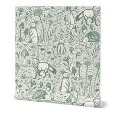 a green and white wallpaper with an image of rabbits in the woods on it