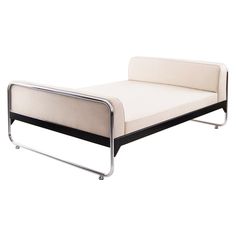 a white and black daybed sitting next to each other