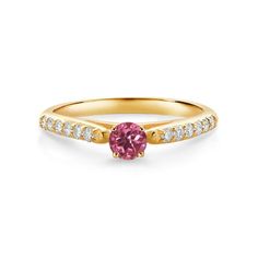 a yellow gold ring with a pink sapphire and diamonds