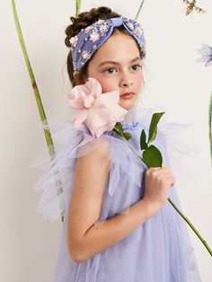 Introducing the Antoinette Headband, a delightful accessory crafted on plume silk. Adorned with hand-applied crystals, pearls and beads intricately arranged in charming floral designs, this headband adds a touch of elegance to any ensemble. Perfectly paired with the Antoinette Tulle Dress, it completes the look with grace and sophistication. Let this headband be the finishing touch that elevates your little one's outfit, ensuring she shines with timeless beauty and charm. Shipping and Returns Th Antoinette Dress, Blue Tutu, Woven Cotton, Floral Patterns, Tulle Dress, Floral Designs, Cotton Weaving, Dress Accessories, Timeless Beauty