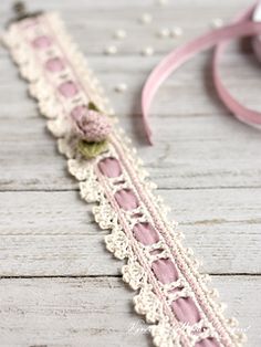 a close up of a ribbon on a wooden surface