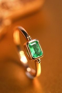 •Condition: Brand new•Center Stone: Natura emerald from Zambia, Emerald Cut, approx 0.5ct, 6X4mm•Side Stone: Natural White Diamond, round cut (VS1 clarity and F color) •Ring Dimension: 19x5mmEach piece is made-to-order with care and special attention to detail. all items are made with conflict-free diamonds and gems.Size: made to orderThe item will be gift wrapped and shipped.---------------------------------------------------------Available in :14k Rose or Yellow Gold, White Gold18k Rose or Yel Flip Rings Jewelry, Promise Emerald Ring In Yellow Gold, Classic Emerald Ring For Promise, Dainty Gold Emerald Cut Emerald Ring, Luxury Emerald Solitaire Ring, Fine Jewelry Yellow Gold Emerald Promise Ring, Fine Jewelry Yellow Gold Emerald Ring For Promise, Heirloom Emerald Cut Emerald Ring For Promise, Heirloom Emerald Cut Promise Ring