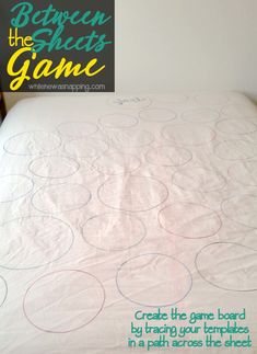 an unmade bed with circles on it and the words between the sheets game written in green