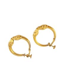 These vintage earrings, crafted by Napier, showcase a luxurious gold-tone finish with intricate detailing. The screwback closures ensure a secure fit, making them ideal for non-pierced ears. Their classic hoop design adds a touch of timeless elegance, perfect for elevating any ensemble. * Vintage Napier earrings * Gold-tone finish * Screwback closures * Hoop design * Intricate detailing * Minor wear consistent with age  * Diameter approximately 1 inch Features: * Etruscan, Roman, vintage, retro, clip on, screw back * Made in United States Size: 1 1/8 inch Condition: Pre-Owned  Minimal where to the gold plating in areas Gold Hoop Clip-on Earrings For Formal Occasions, Formal Gold Plated Hoop Clip-on Earrings, Gold Plated Hoop Clip-on Earrings For Formal Events, Vintage Gold Hoop Earrings In Brass, Vintage Yellow Gold Clip-on Hoop Earrings, Formal Gold Hinged Hoop Earrings, Vintage Gold Clip-on Hoop Earrings, Formal Brass Clip-on Hoop Earrings, Classic Gold Hinged Earrings