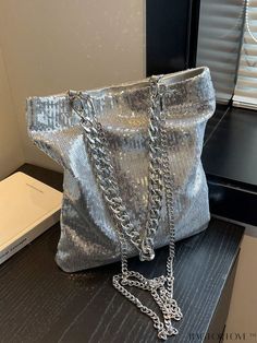 BagForLove - Silver Sequin Square Bag with Metallic Chain: Stylish and Unique Product Description Color Silver Bag Size Medium Pattern Type Plain Material Polyester Composition 50% Viscose Size Chart INCH CM Bag Height Bag Length Bag Width Handle Height 11.8 inch 9.8 inch 1.6 inch 10.2 inch Bag Height Bag Length Bag Width Handle Height 30 cm 25 cm 4 cm 26 cm Details Pictures Similar Products h2 { text-align: center; } /* æ¢è¡ */ li{ white-space: normal; word-break: break-all; word-wrap: break- Silver Bag With Chain Strap For Night Out, Silver Bags With Chain Strap For Night Out, Silver Chain Bag For Night Out, Large Capacity Tote Evening Bag For Party, Silver Bucket Bags With Chain Strap, Party Bucket Shoulder Bag With Large Capacity, Large Capacity Bucket Shoulder Bag For Party, Large Capacity Silver Party Bag, Party Large Capacity Bucket Shoulder Bag