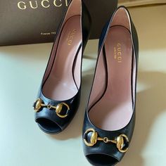 Size 5, Black Leather With Horse Buckle. Has A Small Discoloration Of The Bottom Of The Shoe From Removing Tag. Never Worn. In Exceptional Condition. Includes Dust Bag And Comes With The Original Box. Luxury High Heel With Horsebit Detail, Designer Formal Heels With Horsebit Detail, Evening High Heels With Horsebit Detail, Gucci Black Heels With Horsebit Detail, Gucci Horsebit Heels For Office, Gucci Almond Toe Heels For Office, Designer Gucci Heels With Almond Toe, Elegant Black Heels With Horsebit Detail, Gucci High Heels For Office