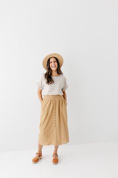 Start your day in style with the 'Greta' Skirt! This midi length, linen-blend skirt is light and airy for spring and summer and features button-down detailing for a fun touch. Pair the 'Greta' with all your favorite tops for Sunday morning or a day at the farmer's market! 30% Linen 70% Rayon Hand Wash Cold Hang to Dry Low Iron if Needed Do Not Dry Clean Fully Lined Model in Ochre Height 5'5" | Wearing Size Small Wearing 'Shalom' Geometric Print Top in Tan & 'Greta' Linen Blend Midi Skirt in Ochr Lightweight Maxi Skirt For Spring Day Out, Spring Day Out Maxi Skirt, Relaxed Summer Maxi Skirt For Day Out, Summer Relaxed Maxi Skirt For Day Out, Casual Linen Maxi Skirt For Beach, Linen Flowy Skirt For Vacation, Summer Daywear Maxi Skirt With Lining, Flowy Linen Skirt For Vacation, Summer Lined Maxi Skirt For Daywear