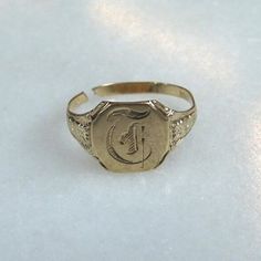 "This is a vintage 10K yellow gold Ostby & Barton signed signet ring.  The Ostby & Barton company was one of the largest jewelry makers at one time.  Ostby was tragically a victim of the Titanic.  The company manufactured from the late 1800s to the 1950's.  There is no catalog to date the company hallmarks, so I can't give an exact date on this one.  The ring has a beautiful \"C\" monogram.  The shank is broken and will need fused back together.  This also makes it easy to have resized.  The rin Antique Gold Engraved Ring Hallmarked, Antique Gold Engraved Hallmarked Ring, Vintage Engraved Rings For Formal Occasions, Victorian Gold Signet Ring Stamped 14k, Victorian Gold Hallmarked Signet Ring, Antique Gold Signet Ring Collectible, Vintage Gold Engraved Signet Ring, Victorian Gold Engraved Collectible Ring, Victorian Gold Signet Ring Gift