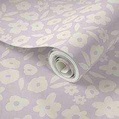 a purple and white wallpaper with flowers on it