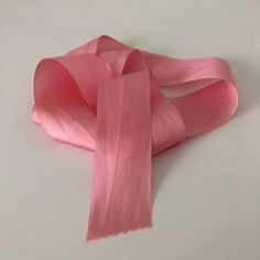 pink satin ribbon on white background