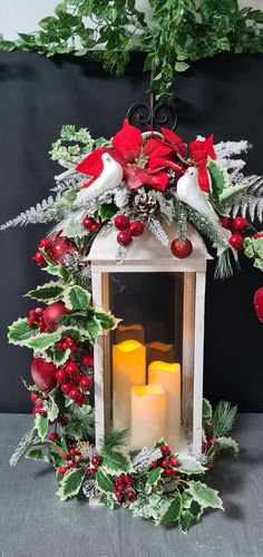 a christmas lantern with candles and decorations