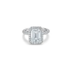 an emerald - cut diamond ring set in 18k white gold