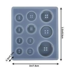 a plastic tray with buttons on it and measurements for each button in the bottom half