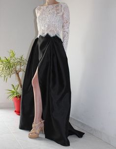 "The 'Aja' wrap-over alternative bridal wedding skirt is made from black, pure silk shantung fabric. Features side pockets and piping on the waistband, tied into a small bow. The skirt wraps over at the front, touching the floor. Shape - full A-line with box pleats. Closure - two hooks and hook eyes on the inside, so they do not show. This fabric is available only in black. If you would like this skirt in ivory, then it can be made from a different fabric of similar structure - mixed silk Mikado (contact us).  - Handmade in our studio - 6-8 week standard production time - Looks great with any of our tops - Available in black silk shantung. (Can also be made in ivory mixed silk Mikado - contact us.) - Fabric should be handled with care - dry-clean only Sizing This skirt is made according to Wrap Over Skirt, Wedding Separates, Black Silk Skirt, Over Skirt, Bridal Tops, Wedding Skirt, Alternative Bridal, Skirt With Pockets, Silk Skirt