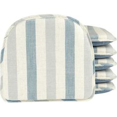 four blue and white striped pillows stacked on top of each other in front of a white background