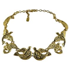 YVES SAINT LAURENT vintage gold toned necklace featuring bird links. Adjustable hook clasp closure. Embossed YSL Made in France. Indicative measurements : adjustable length from approx. 49 cm (19.29 inches) to approx. 54 cm (21.26 inches). NOTES - This is a preloved vintage item, therefore it might have imperfections. - Colors may differ slightly from actual product appearance due to differences in lighting conditions. - As a buyer, you are fully responsible for customs duties, other local taxes Ysl Vintage, Runway Necklace, Saint Laurent Vintage, Bird Necklace, Hook Clasp, Gold Tone Necklace, Link Necklace, Vintage Gold, Made In France