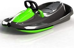 a green and black toy boat on a white surface