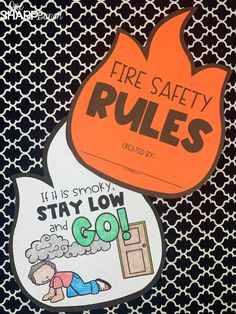 a fire safety rules sticker sitting on top of a black and white background