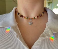 ✿ Citrine and Unakite Heart Trendy Necklace- unakite, moss agate, citrine crystal and clay beads within a variation of colorful glass beads.  The heart pendant is sterling silver plated and is tarnish resistant! ✿ 𝐀𝐛𝐨𝐮𝐭 𝐭𝐡𝐞 𝐏𝐫𝐨𝐜𝐞𝐬𝐬 I buy beads and wire from locally sources bead shops (including handmade glass beads) and then design and string all the necklaces. 𝐒𝐢𝐳𝐢𝐧𝐠 This necklace comes in the sizes 16, 18 and 20 inches. 𝐂𝐨𝐥𝐨𝐫𝐬 The colors in the photo indicate the typ Everyday Multicolor Jewelry With Heart Charm, Heart Pendant Jewelry With Colorful Beads For Gift, Everyday Heart-shaped Colorful Beads Jewelry, Heart-shaped Beaded Necklaces With Natural Stones, Heart-shaped Beaded Necklaces With Natural Stones For Gift, Heart-shaped Natural Stone Beaded Necklace For Gift, Heart-shaped Beaded Necklace With Natural Stones For Gift, Multicolor Heart Beads Sterling Silver Jewelry, Multicolor Sterling Silver Heart Beads Jewelry