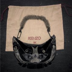 [Kenzo] Black Tan Leather Patchwork Face Metal Handle Bag With Dust Bag Metal Ring Handle Connected Irregularly: Messed Up (You Can Make It Better Shape) Like New Designer Black Clutch Evening Bag, Designer Leather Evening Bag, Designer Black Evening Bag With Removable Pouch, Designer Evening Pouch Shoulder Bag, Designer Leather Evening Bag For Party, Designer Black Evening Bag, Black Leather Evening Bag, Leather Patchwork, Ring Handle