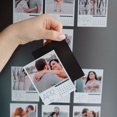 a person holding up a calendar with photos on it and the date in front of them