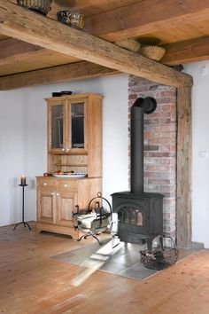 a wood burning stove sitting inside of a living room