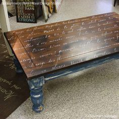 a wooden table with writing on it in a store