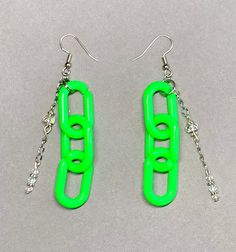 "Pop all the bottles with this sparkly set of neon green/silver chain link earrings! Featuring aurora borealis swarovski crystal glass, quartz & aquamarine beads for truth, wisdom & clarity.  All pieces were made using Swarovski Crystal + aquamarine + quartz beads + silver spacers, brass head pins, clasps, findings & wire. Green chain link is made of plastic. (Drop is 3\" long.) Items ship within 24 hours! CHECK OUT MY CUSTOM JEWELRY LISTING FOR A SIMILAR PIECE OR TO MAKE IT A FULL SET! 10% of all purchases in The Festival Shop will be donated to supporting homeless transgender youth & adults - My Friend's Place (Los Angeles), Trans Resistance Mass & Transanta!" Trendy Green Dangle Jewelry, Trendy Green Chain Link Jewelry, Green Pierced Jewelry For Party, Trendy Neon Jewelry, Trendy Neon Jewelry For Party, Green Adjustable Chain Jewelry For Party, Green Jewelry With Adjustable Chain For Party, Green Chain Jewelry For Party, Neon Yellow Trendy Jewelry For Party