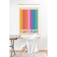 a poster with the words have fun on it in front of a table and chair