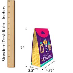 a paper bag with the measurements for it to be cut out and placed on a ruler