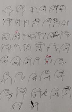 an image of many different faces drawn in black and white ink on paper with red marker