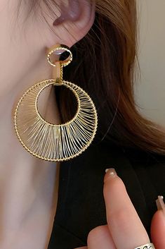 Elevate your style with our Metal Hollow Large Circle Earrings. These striking earrings feature intricate metalwork in a bold circular design, adding a touch of elegance to your look. Crafted with high-quality materials, they not only enhance your allure but also exude sophistication. Perfect for formal occasions, cocktail parties, or when you want to make a statement with your outfit, these earrings are the ideal choice to complement your ensemble with a touch of contemporary charm. Trendy Hoop Earrings Made Of Alloy, Trendy Alloy Hoop Earrings, Round Alloy Earrings For Parties, Gold Alloy Hoop Earrings, Trendy Pierced Alloy Hoop Earrings, Trendy Pierced Hoop Earrings, Metal Hoop Earrings For Parties, Trendy Metal Round Earrings, Trendy Round Metal Earrings